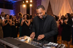 dj turning up the music in front of a crowd